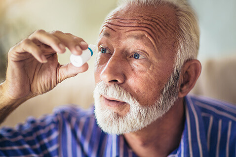 Older man with eyedrops